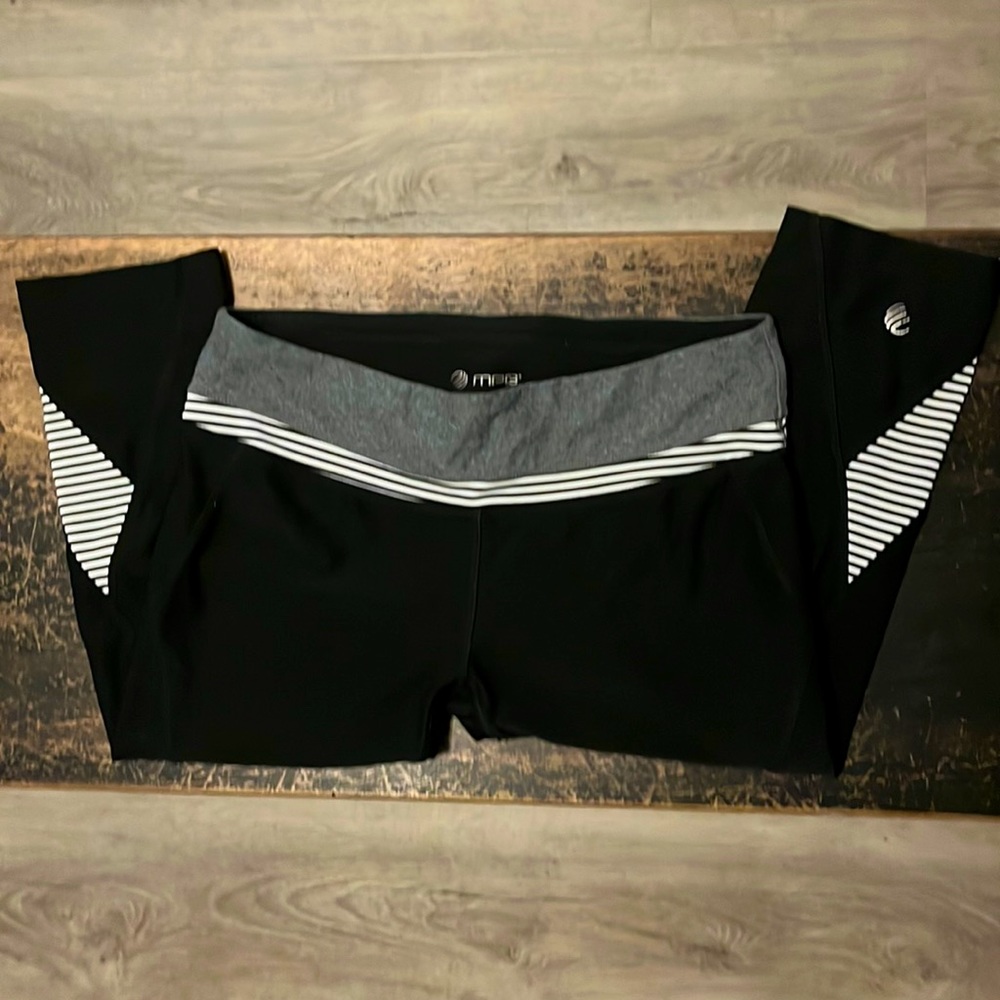 MPG low rise black capris w/ stripe detail. Size medium.